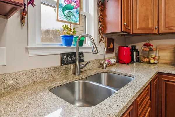 a kitchen with a sink and a window