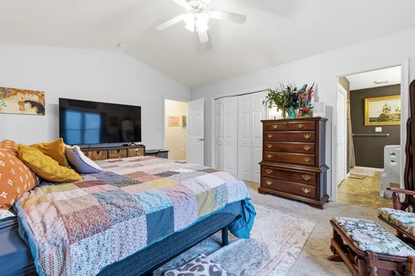 a bedroom with a bed and furniture
