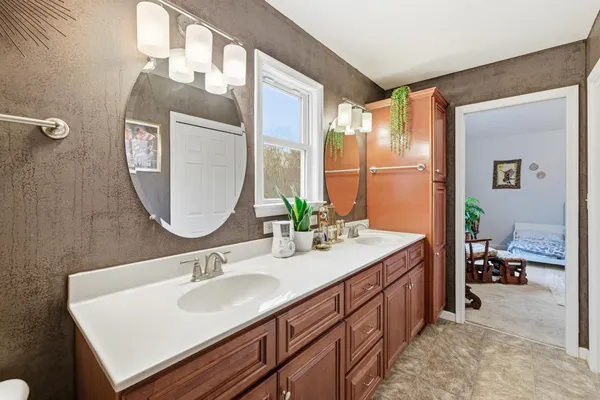 a bathroom with a sink and a mirror