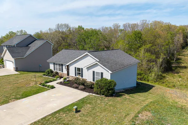 front view of a house with a yard