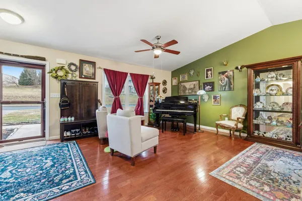 a living room with furniture and a rug