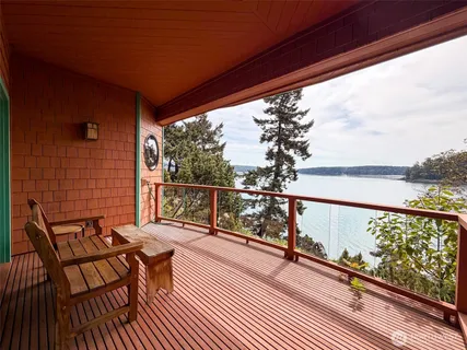 a view of a balcony with wooden floor