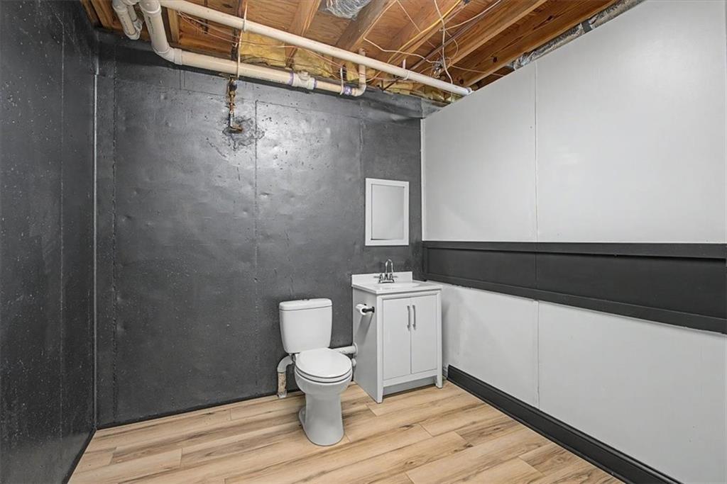 1136 Cole Lake Road Dallas, GA 30157 - Photo 55 of 72 a bathroom with a toilet and a sink