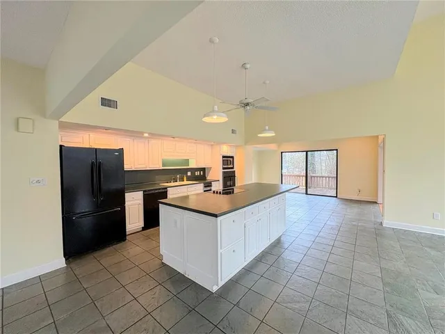an empty room with sliding glass door