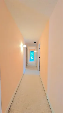 a view of empty room with floor to ceiling window