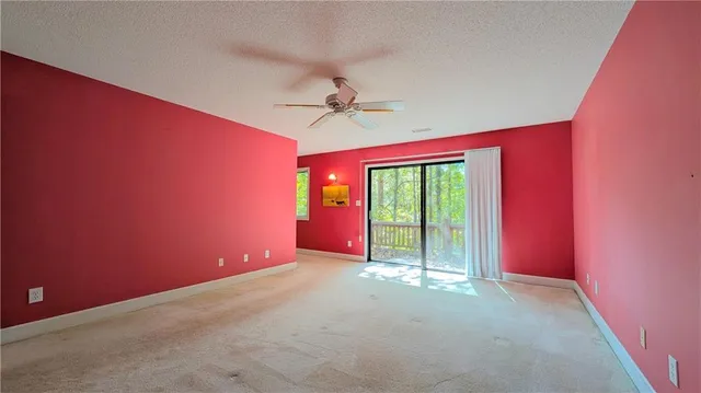 a view of a balcony with trees