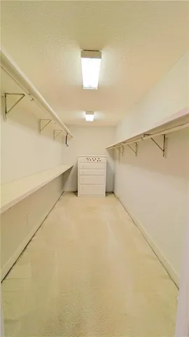 a bathroom with a tub and a window