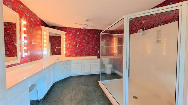 a large spacious bathroom with a large tub and shower