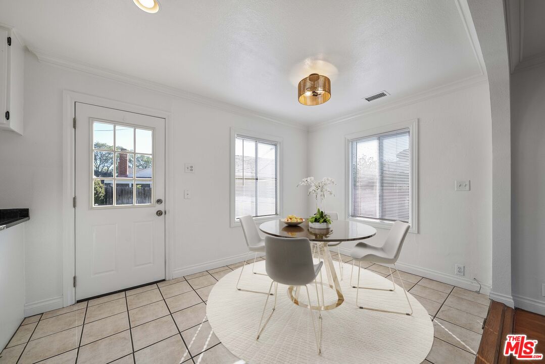 4516 Walnut Avenue Long Beach, CA 90807 - Photo 14 of 35 a dining room with furniture and window