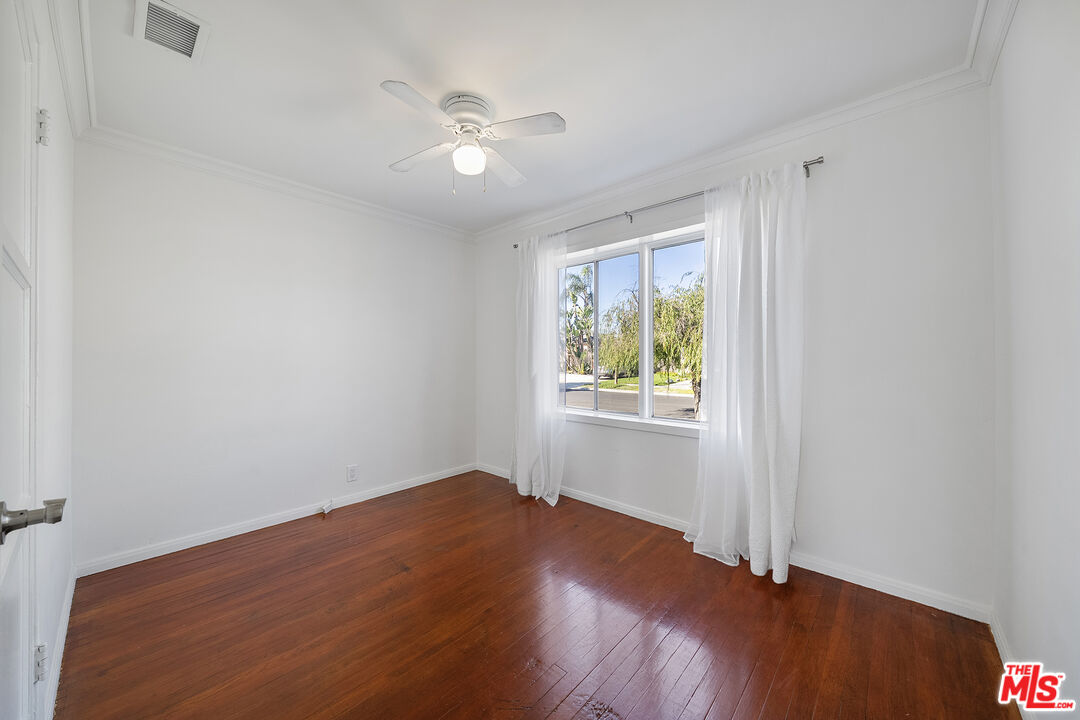4516 Walnut Avenue Long Beach, CA 90807 - Photo 21 of 35 wooden floor in an empty room with a window