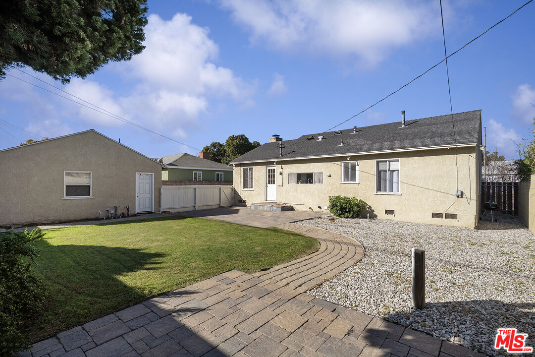 4516 Walnut Avenue Long Beach, CA 90807 - Photo 24 of 35 a front view of a house with a garden