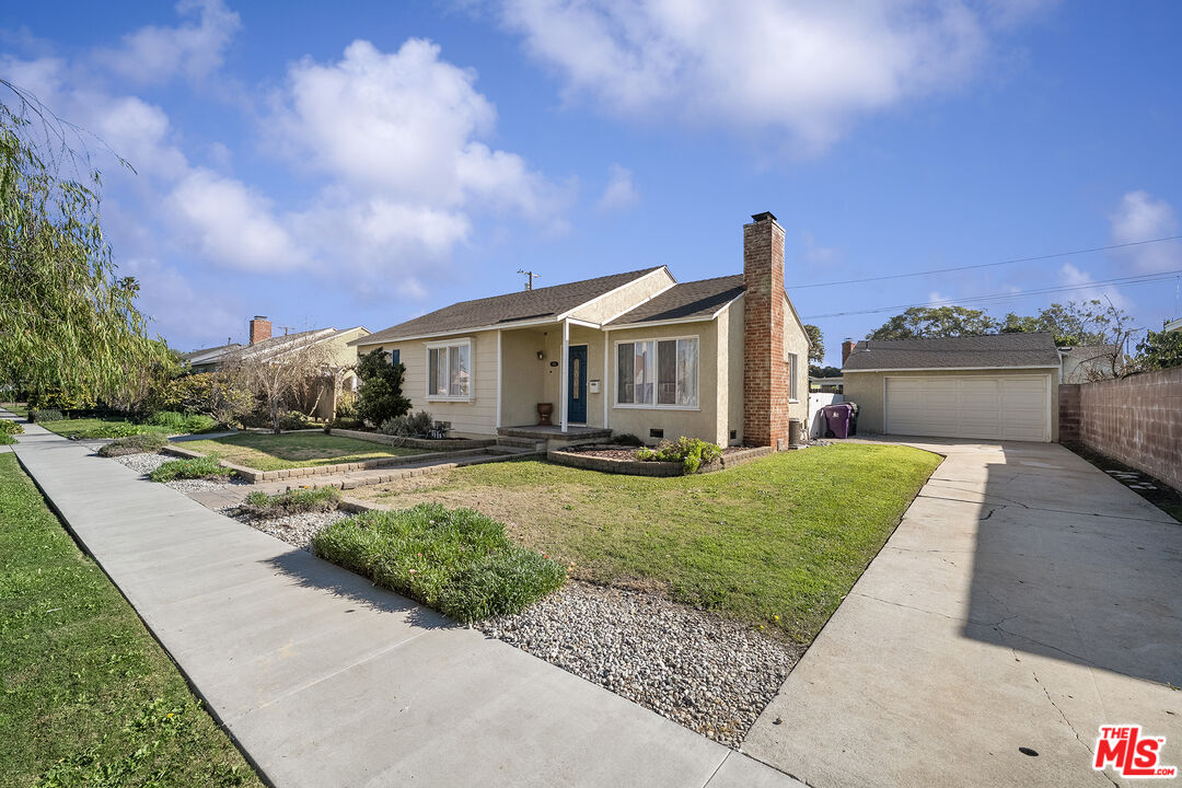 4516 Walnut Avenue Long Beach, CA 90807 - Photo 31 of 35 a front view of a house with a yard