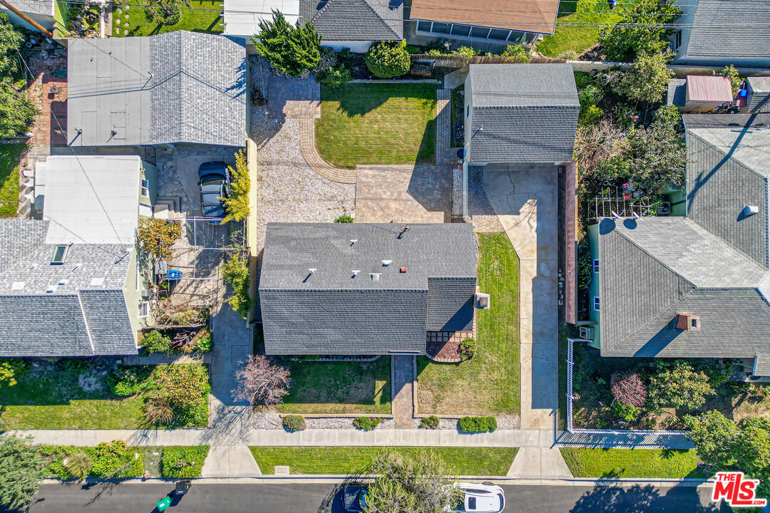 4516 Walnut Avenue Long Beach, CA 90807 - Photo 32 of 35 a aerial view of a house with swimming pool and a yard