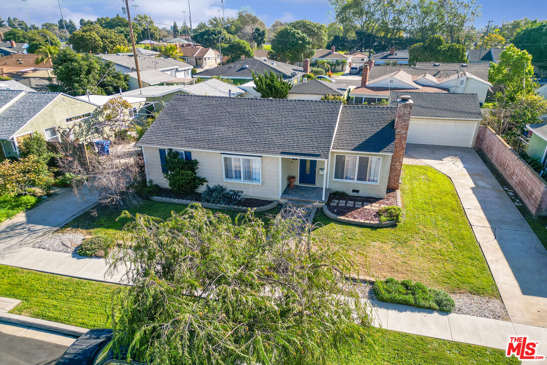 4516 Walnut Avenue Long Beach, CA 90807 - Photo 33 of 35 an aerial view of a house with swimming pool patio and lake view