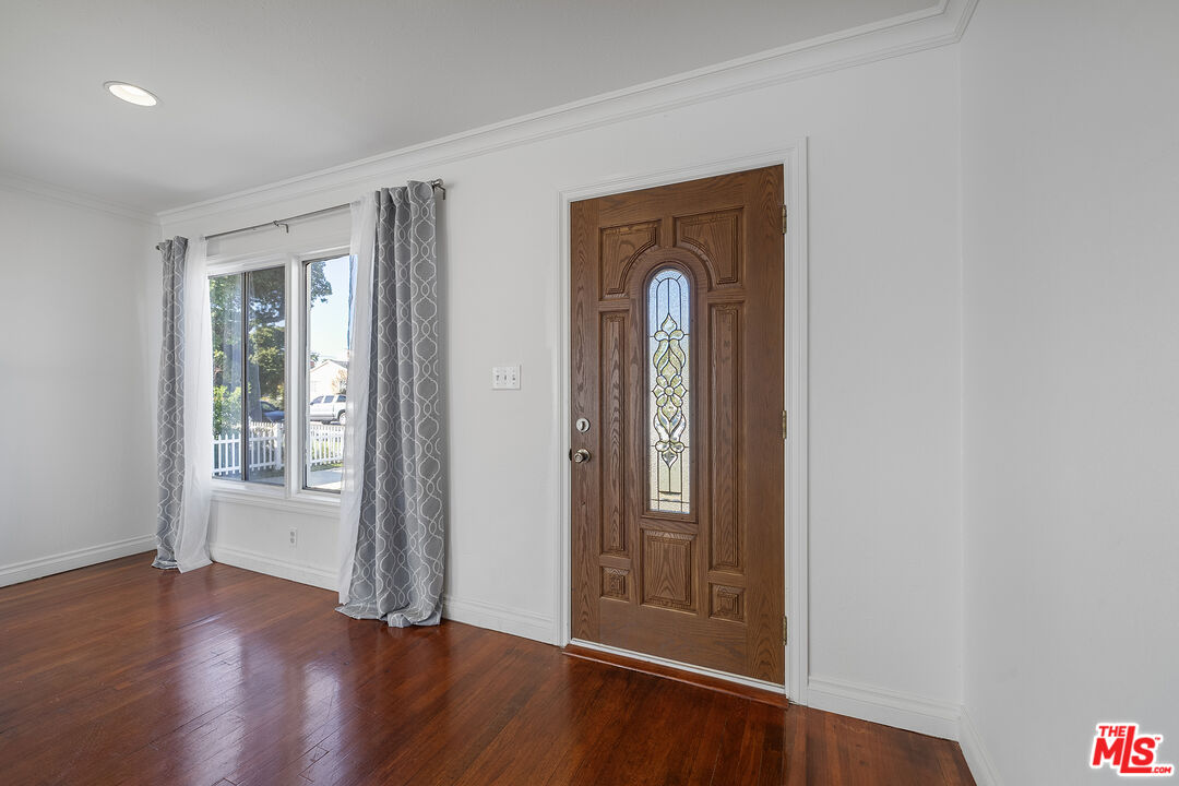 4516 Walnut Avenue Long Beach, CA 90807 - Photo 4 of 35 an empty room with wooden floor door and windows