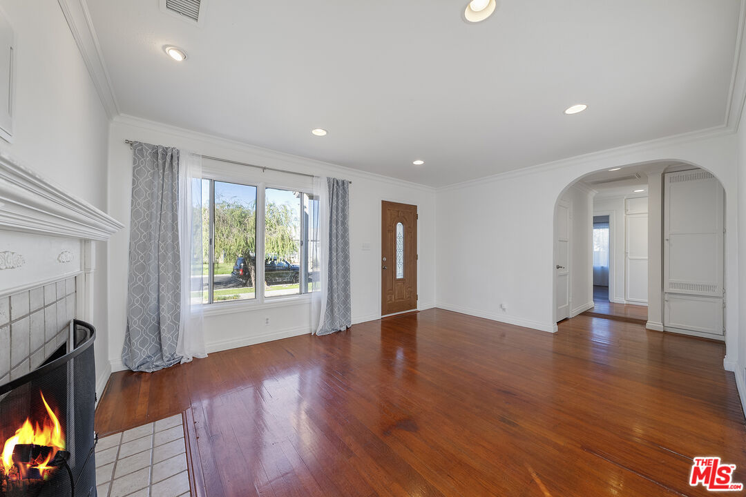 4516 Walnut Avenue Long Beach, CA 90807 - Photo 6 of 35 a view of an empty room with wooden floor and a window