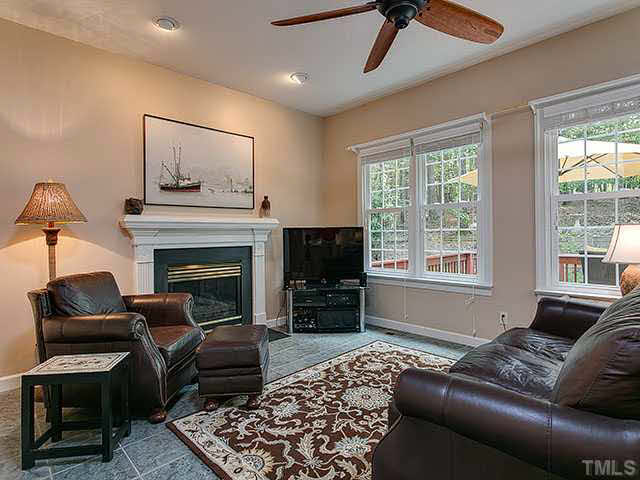 805 Bromley Way Raleigh, NC 27615 - Photo 25 of 25 a living room with furniture and a fireplace