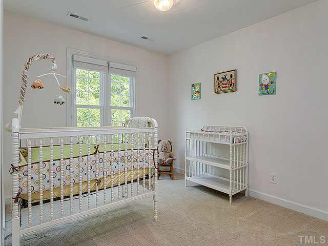 805 Bromley Way Raleigh, NC 27615 - Photo 20 of 25 a bedroom with baby crib and a window