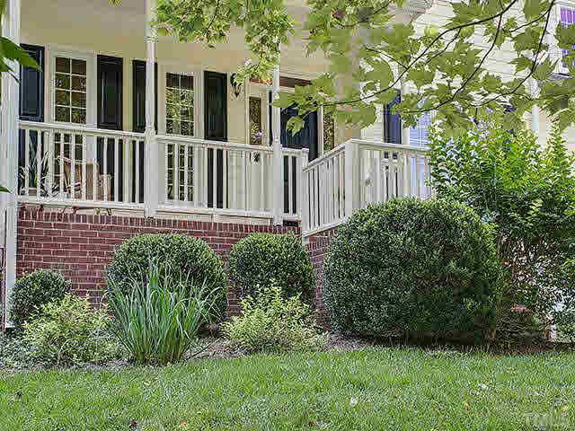 805 Bromley Way Raleigh, NC 27615 - Photo 23 of 25 a view of a house with a small yard and plants