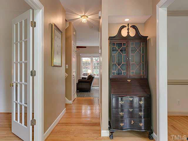 805 Bromley Way Raleigh, NC 27615 - Photo 3 of 25 a view of a hallway with wooden floor windows and a livingroom