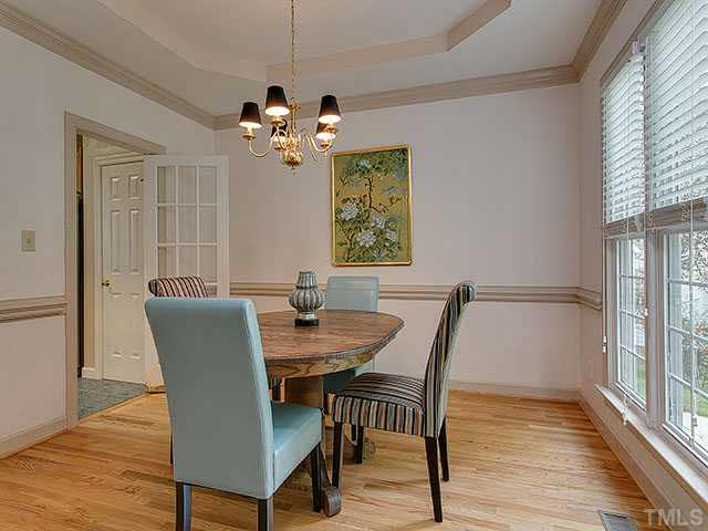 805 Bromley Way Raleigh, NC 27615 - Photo 4 of 25 a view of a dining room with furniture window and wooden floor