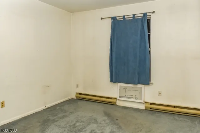 an empty room with wooden door