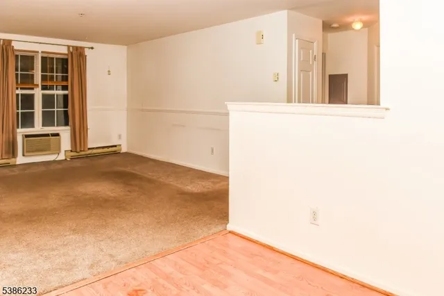 a view of a room with a large window