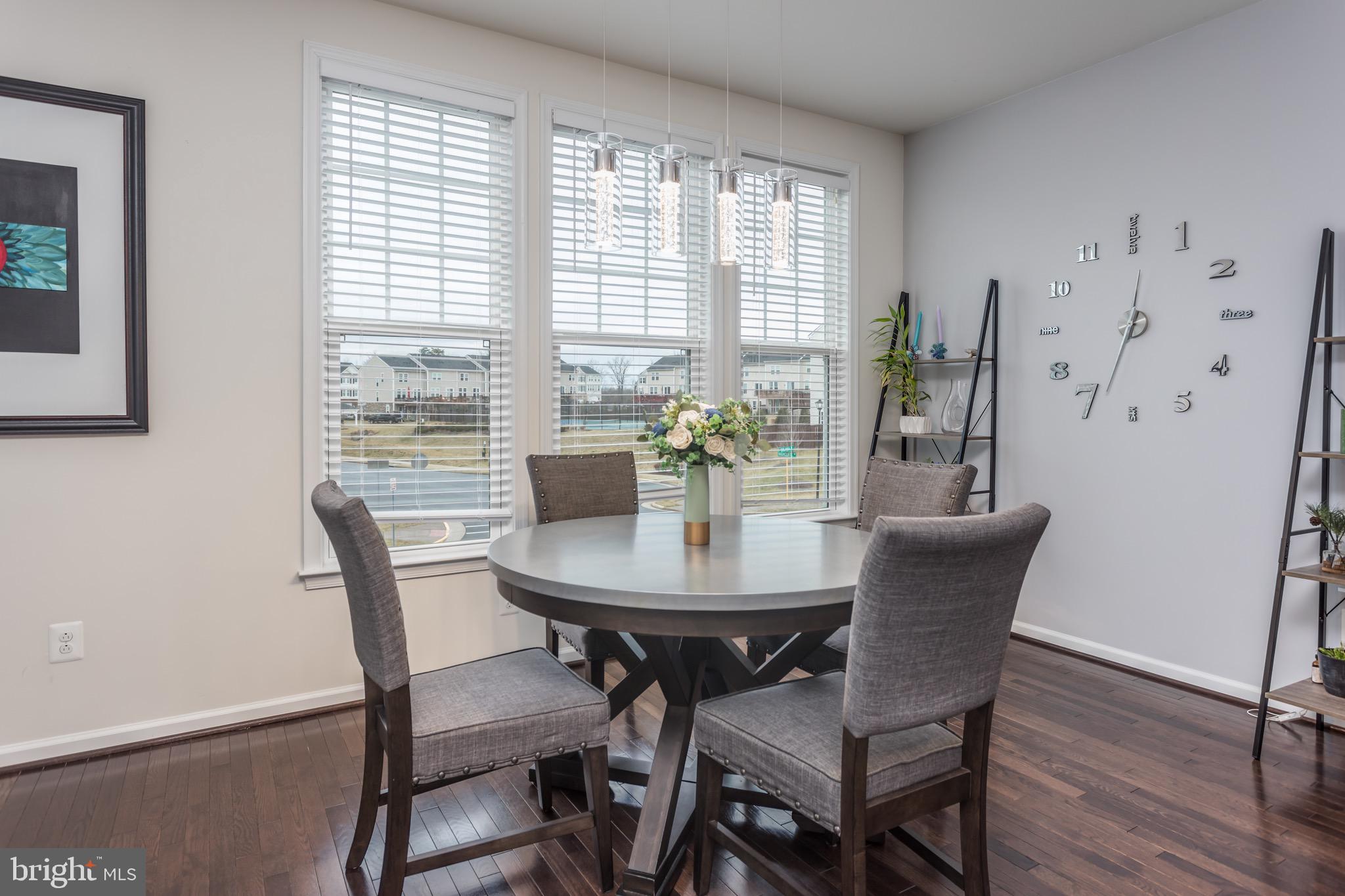 148 Solara Drive Winchester, VA 22602 - Photo 13 of 32 a dining room with furniture and wooden floor