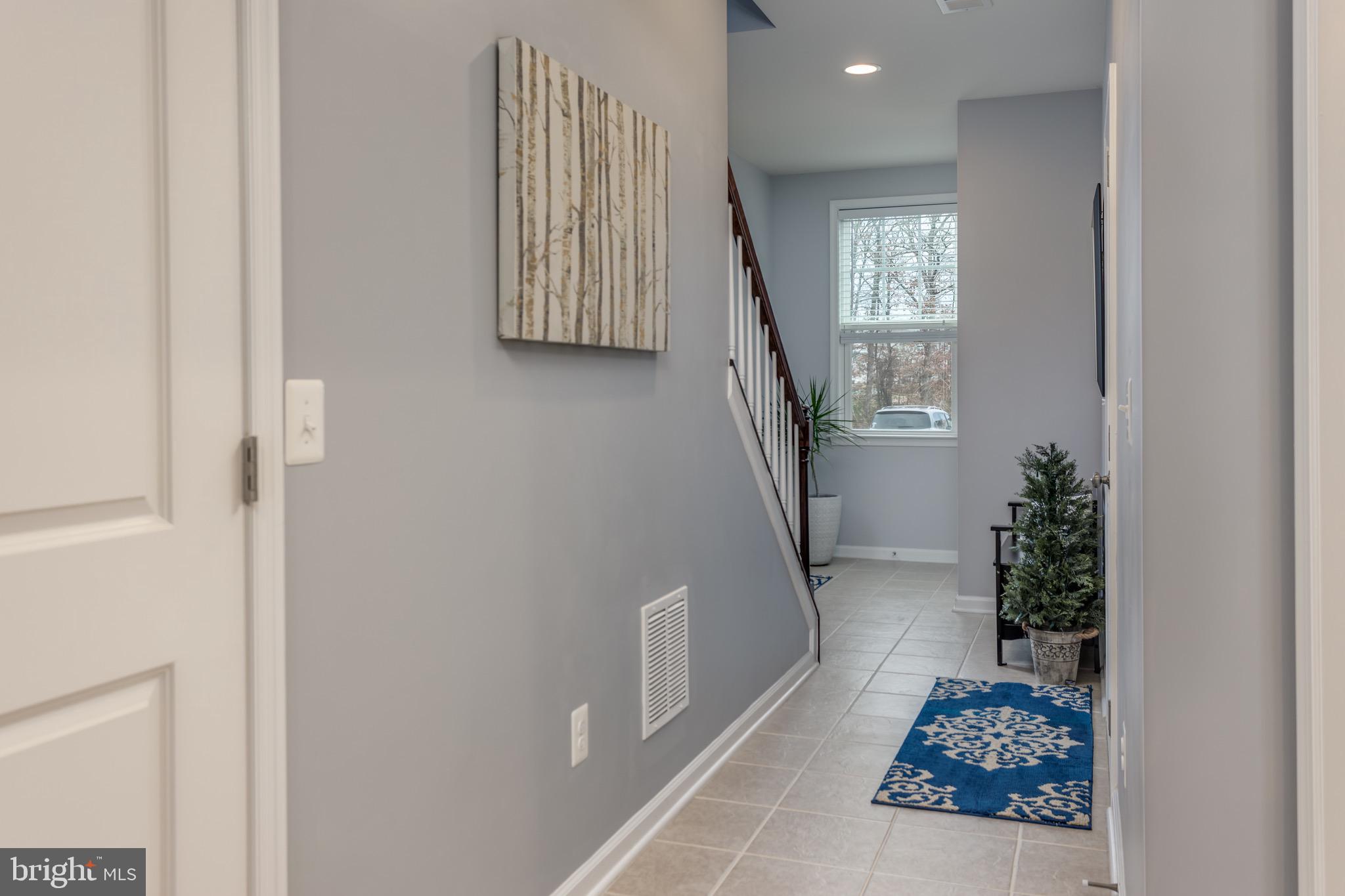 148 Solara Drive Winchester, VA 22602 - Photo 2 of 32 a view of entryway with furniture and stairs