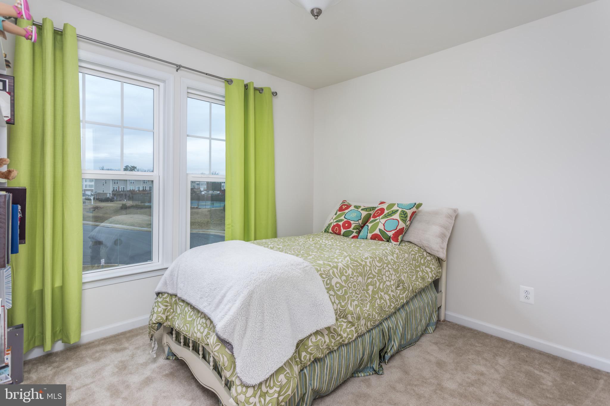 148 Solara Drive Winchester, VA 22602 - Photo 21 of 32 a bedroom with a bed and a window