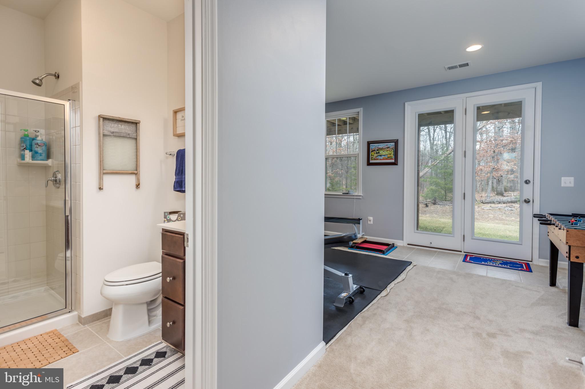 148 Solara Drive Winchester, VA 22602 - Photo 3 of 32 a bathroom with a granite countertop sink and a toilet