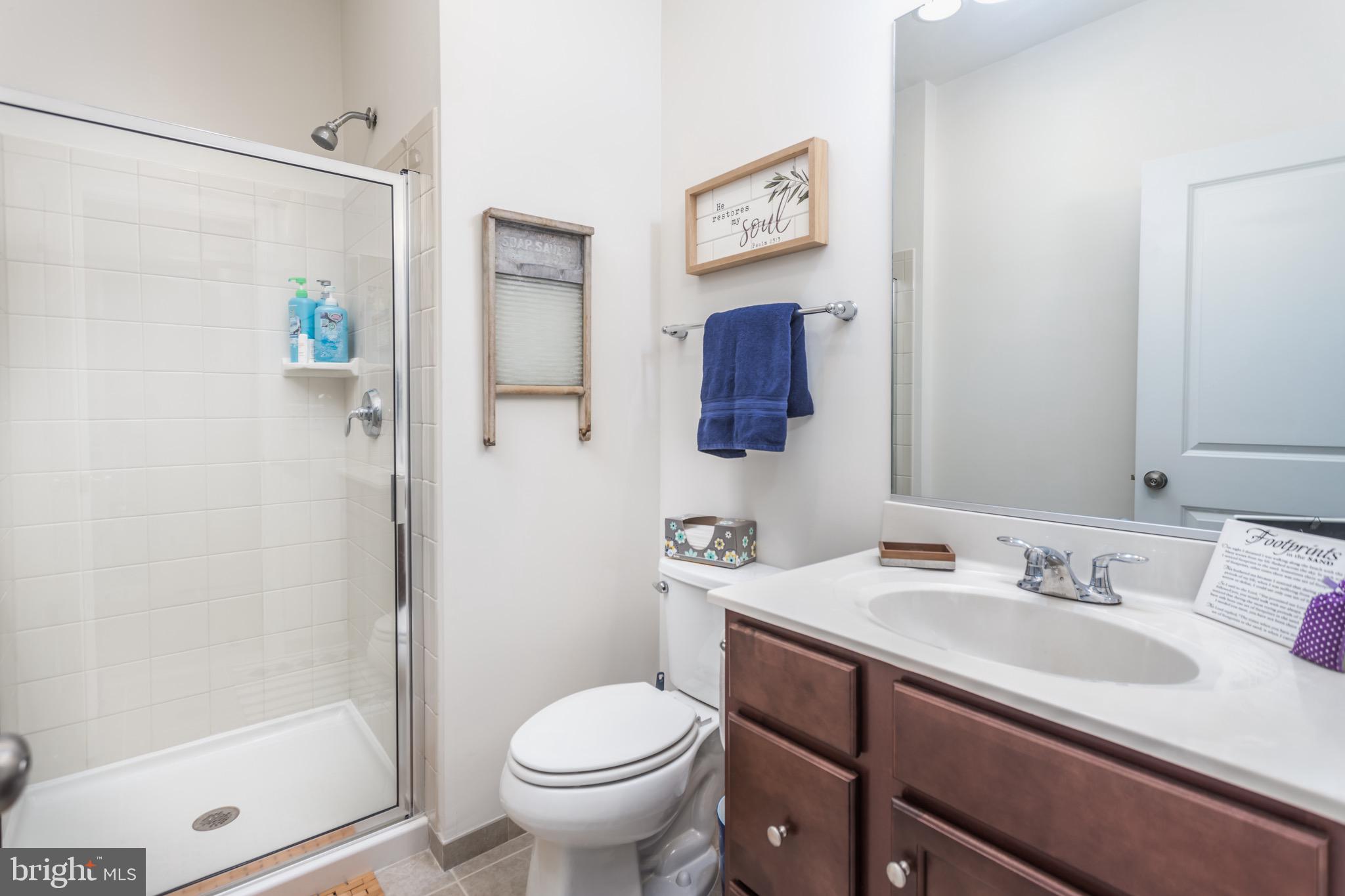 148 Solara Drive Winchester, VA 22602 - Photo 4 of 32 a bathroom with a sink toilet and shower