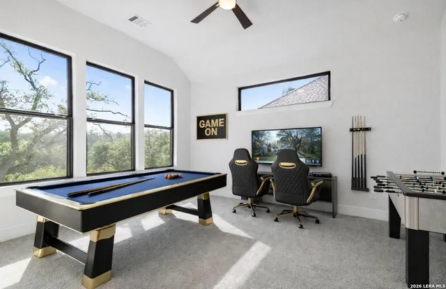 a room with lounge chair and a large window