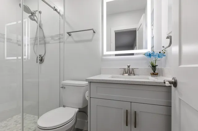 a view of walk in closet with wooden floor