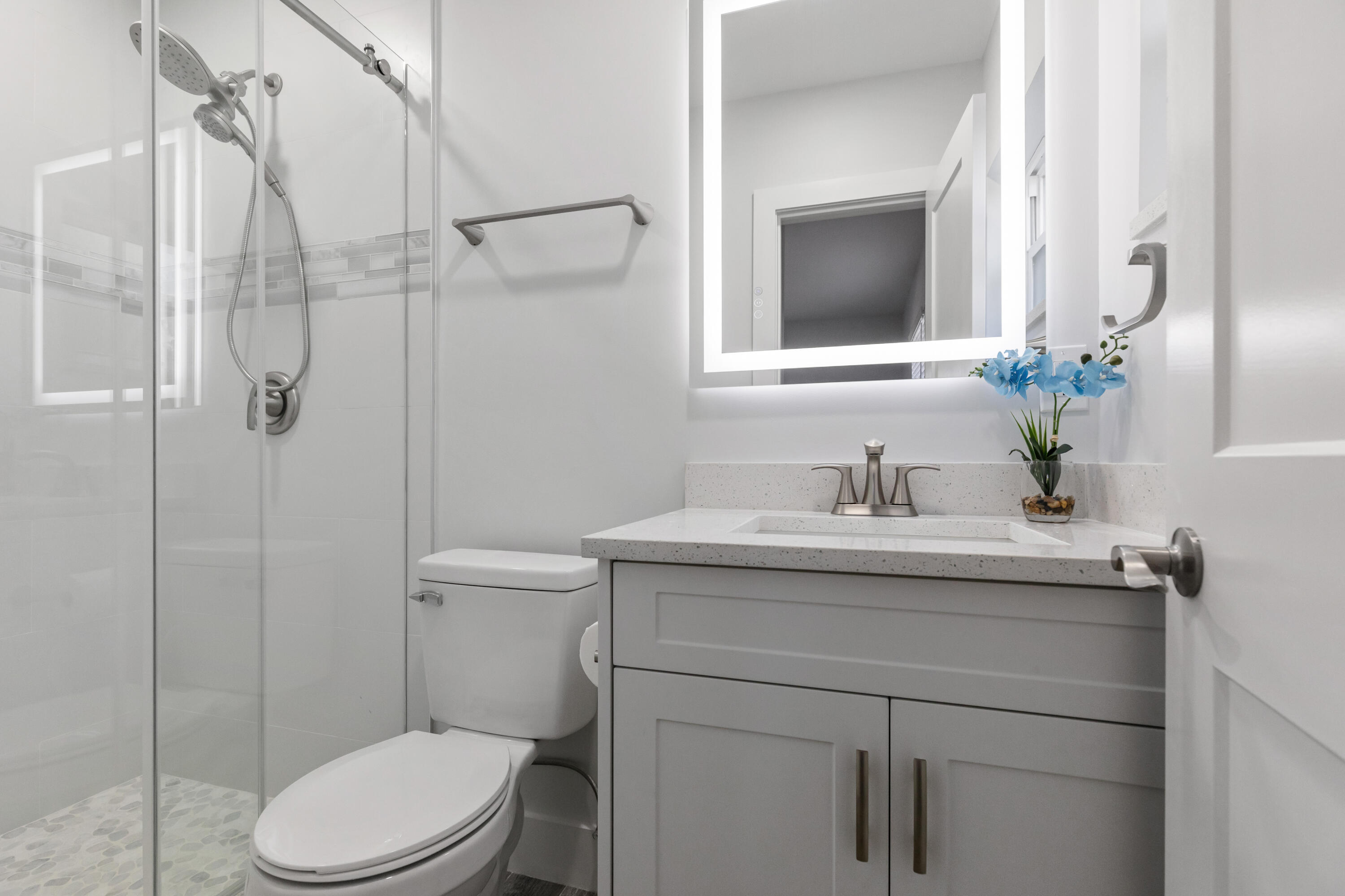 702 South 12th Street Lantana, FL 33462 - Photo 11 of 26 a bathroom with a granite countertop sink toilet and shower