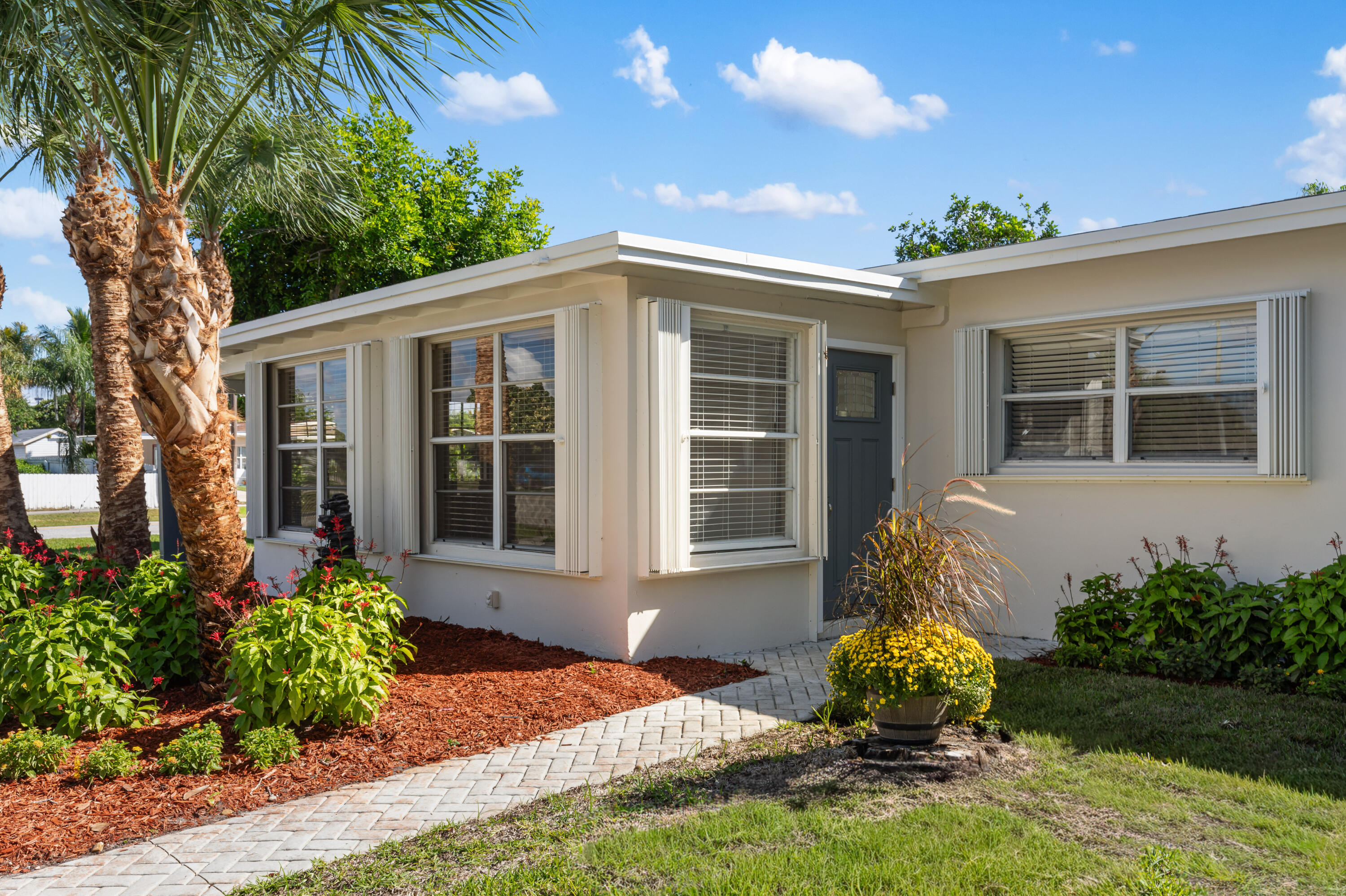 702 South 12th Street Lantana, FL 33462 - Photo 19 of 26 a front view of a house with garden