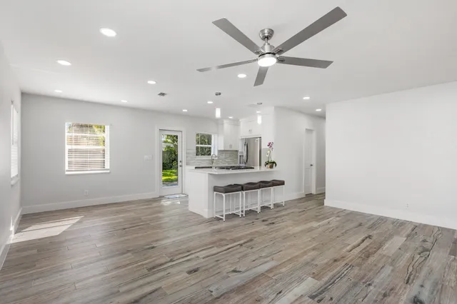 a front view of a house with a yard table and chairs