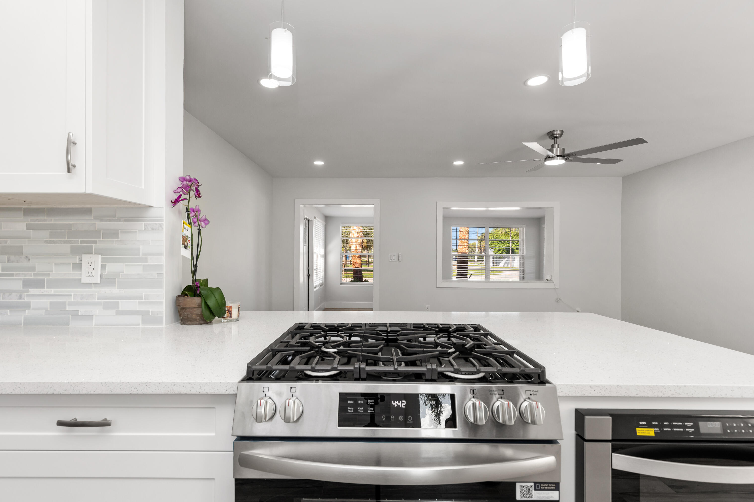 702 South 12th Street Lantana, FL 33462 - Photo 7 of 26 a stove top oven sitting inside of a kitchen