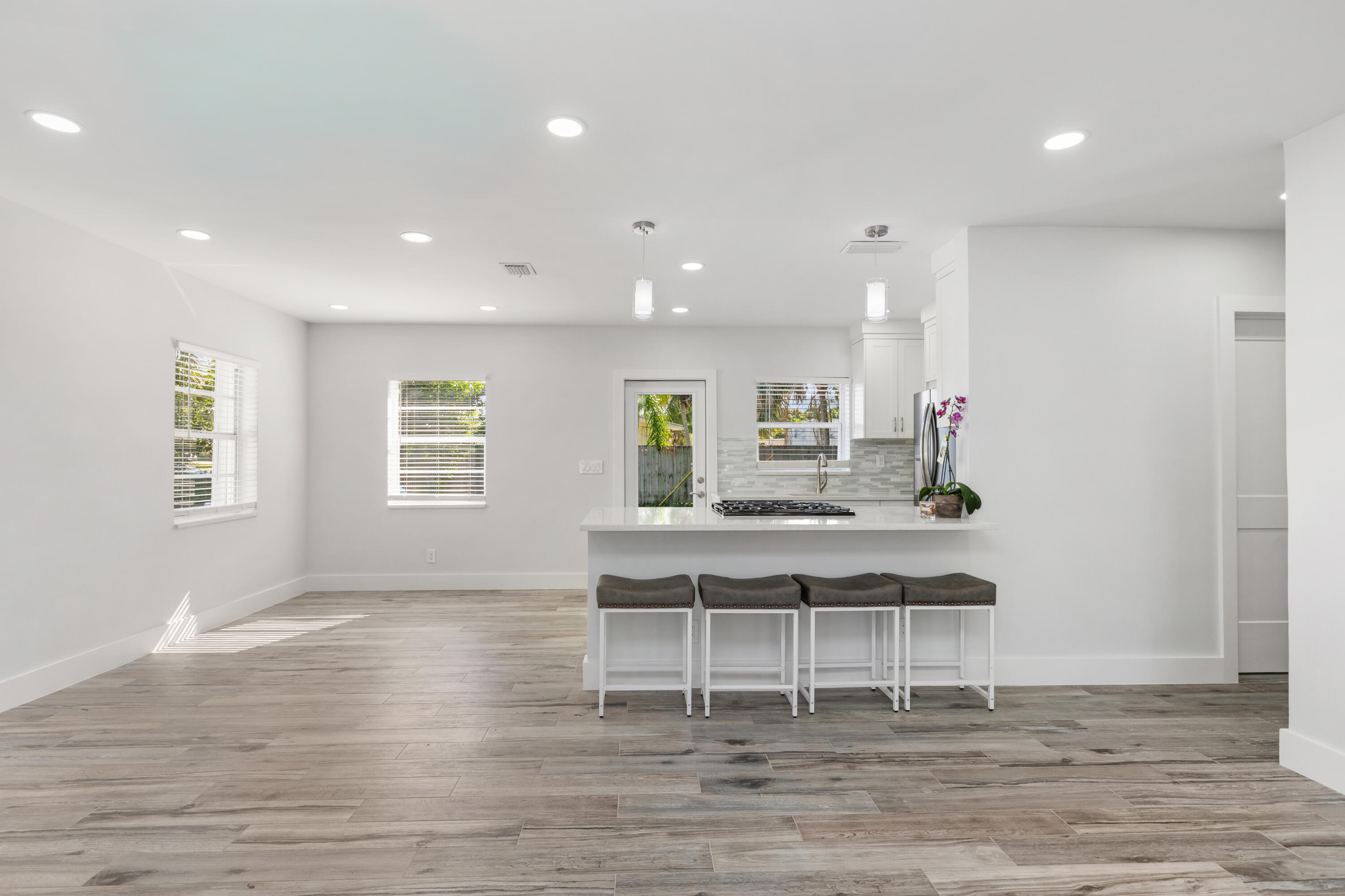 702 South 12th Street Lantana, FL 33462 - Photo 8 of 26 a kitchen with a table and chairs in it