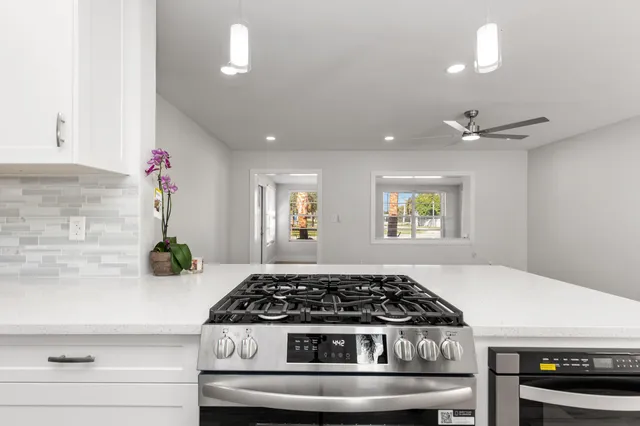 a kitchen with a table and chairs in it