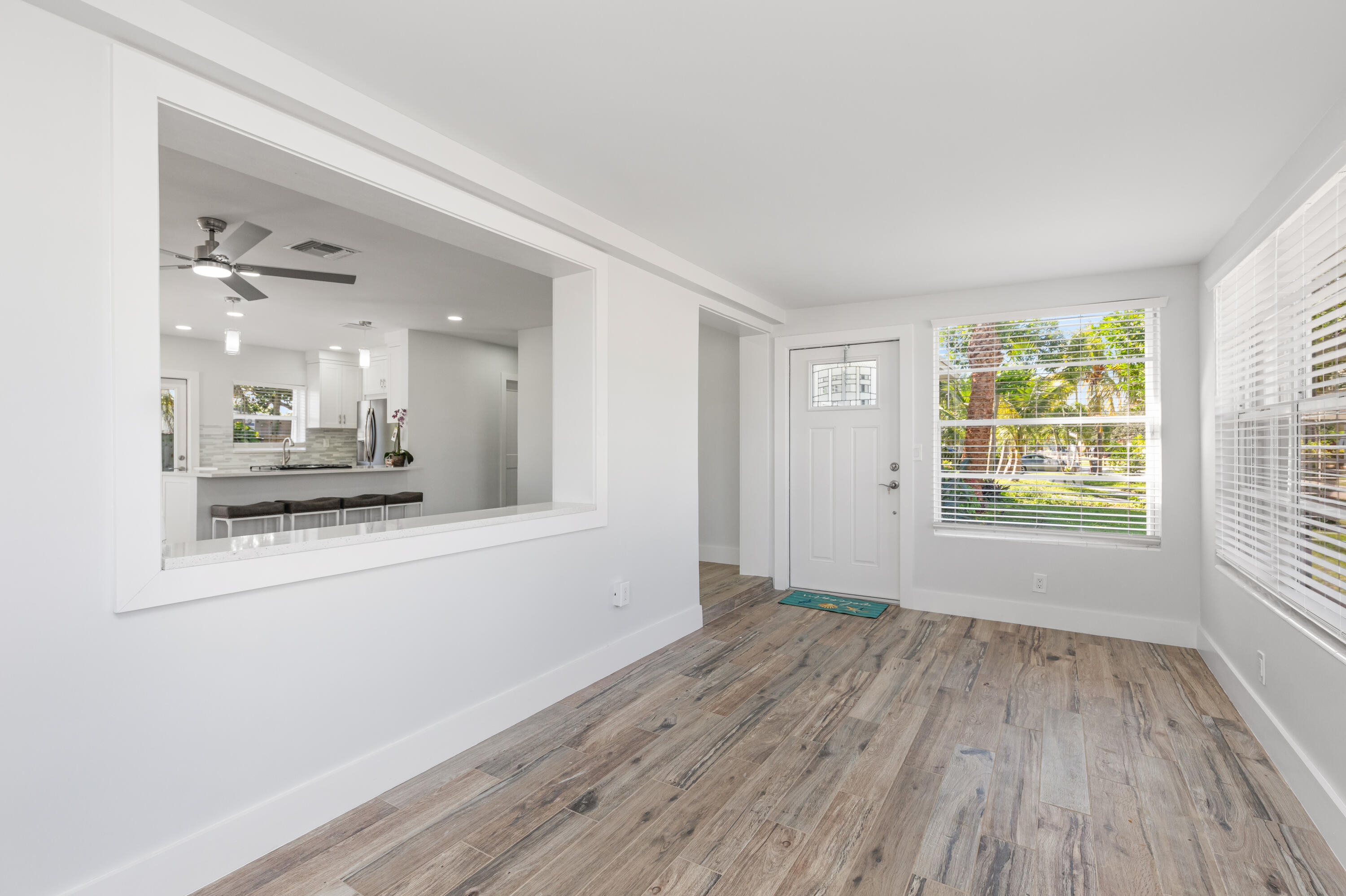 702 South 12th Street Lantana, FL 33462 - Photo 10 of 26 a bathroom with a wooden floor and a large window