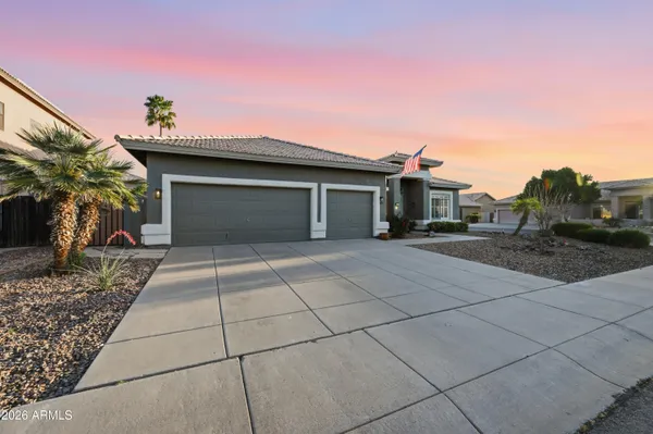 a living room with furniture a flat screen tv and a window