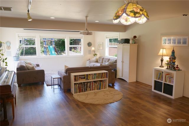 a view of a dining room with furniture window and wooden floor