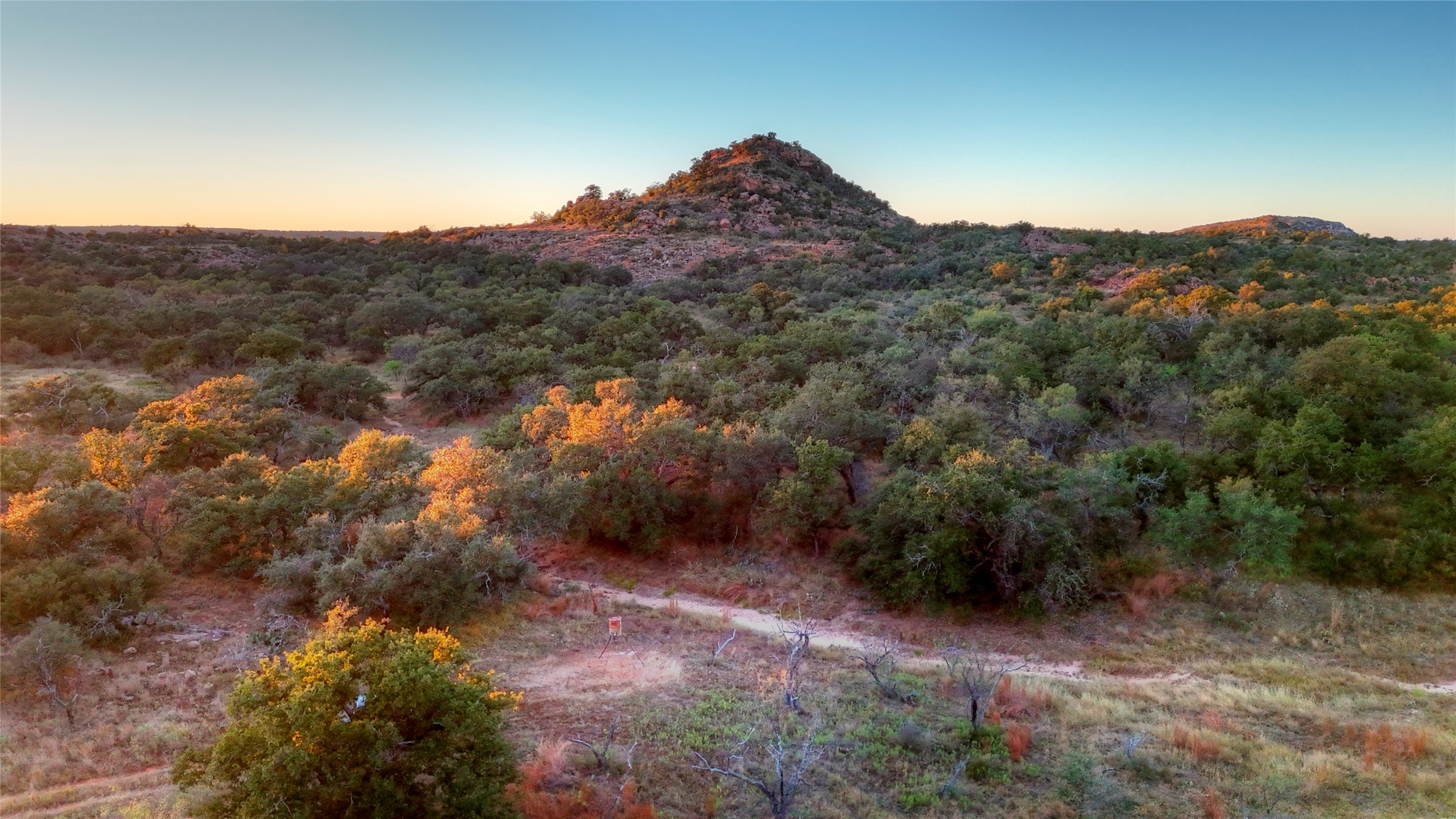 18248 Bode Peak Road Pontotoc, TX 76869 - Photo 13 of 19 a view of a mountain in the distance in a field
