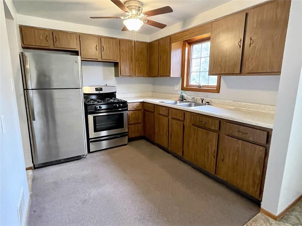246 McConnell Road Canonsburg, PA 15317 - Photo 3 of 22 a kitchen with stainless steel appliances granite countertop a refrigerator a sink a stove a microwave and island