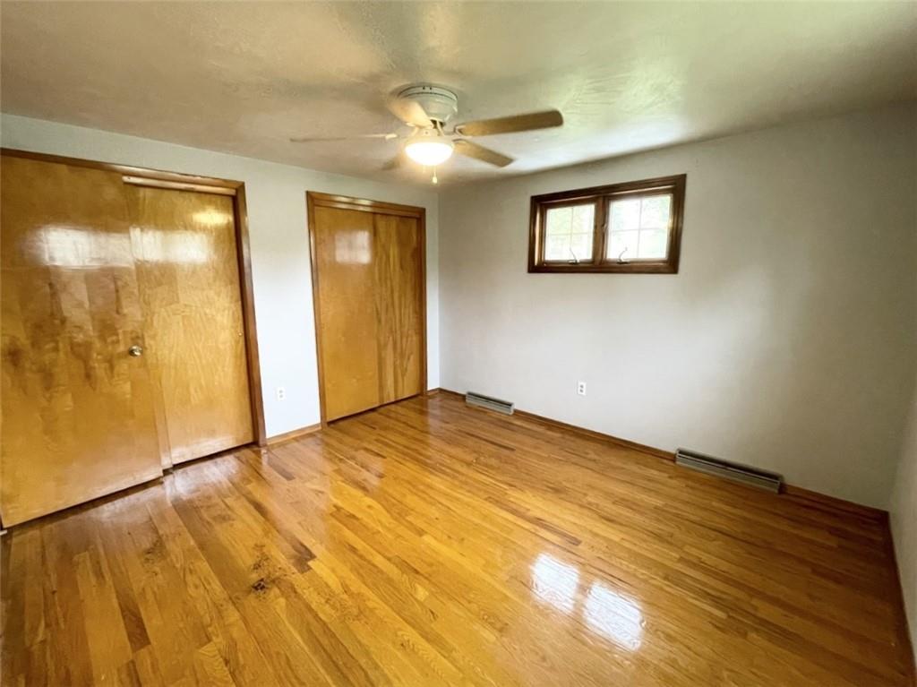 246 McConnell Road Canonsburg, PA 15317 - Photo 8 of 22 a view of empty room with wooden floor and fan