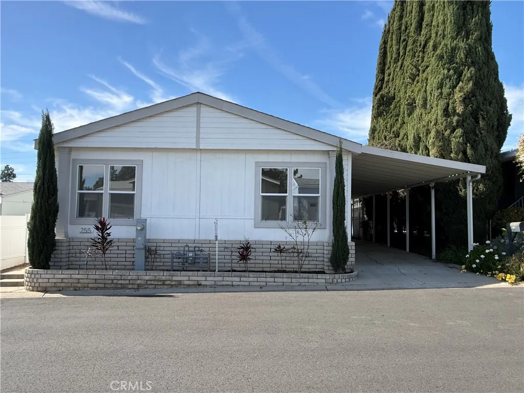 1051 Site, Unit 255 Brea, CA 92821 - Photo 1 of 30 a front view of a house with a garden