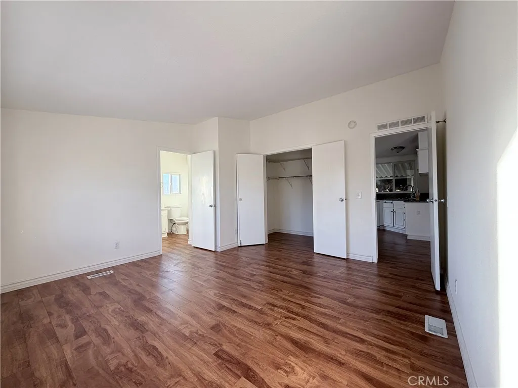 1051 Site, Unit 255 Brea, CA 92821 - Photo 11 of 30 a view of an empty room and wooden floor