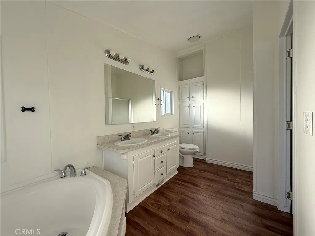 1051 Site, Unit 255 Brea, CA 92821 - Photo 15 of 30 a bathroom with a double vanity sink and a mirror