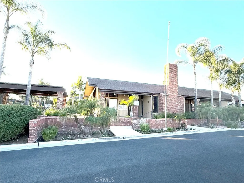 1051 Site, Unit 255 Brea, CA 92821 - Photo 25 of 30 a front view of a house with a yard and garage